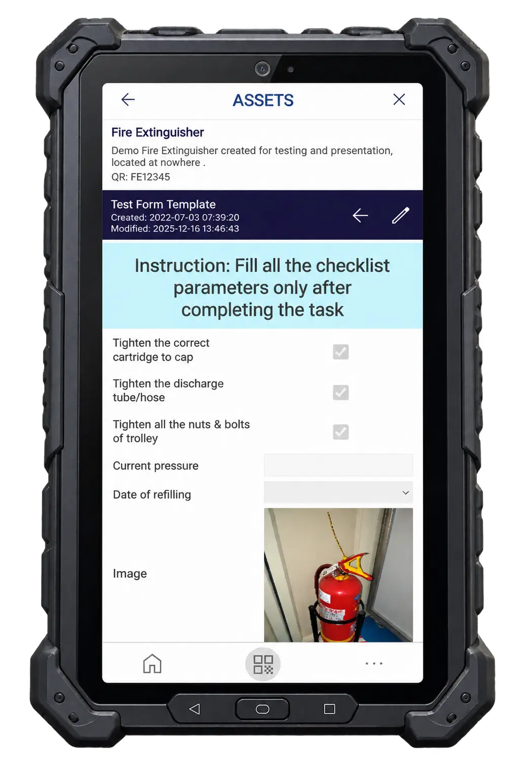 A fire-extinguisher inspection checklist opened on a rugged tablet after scanning the asset QR